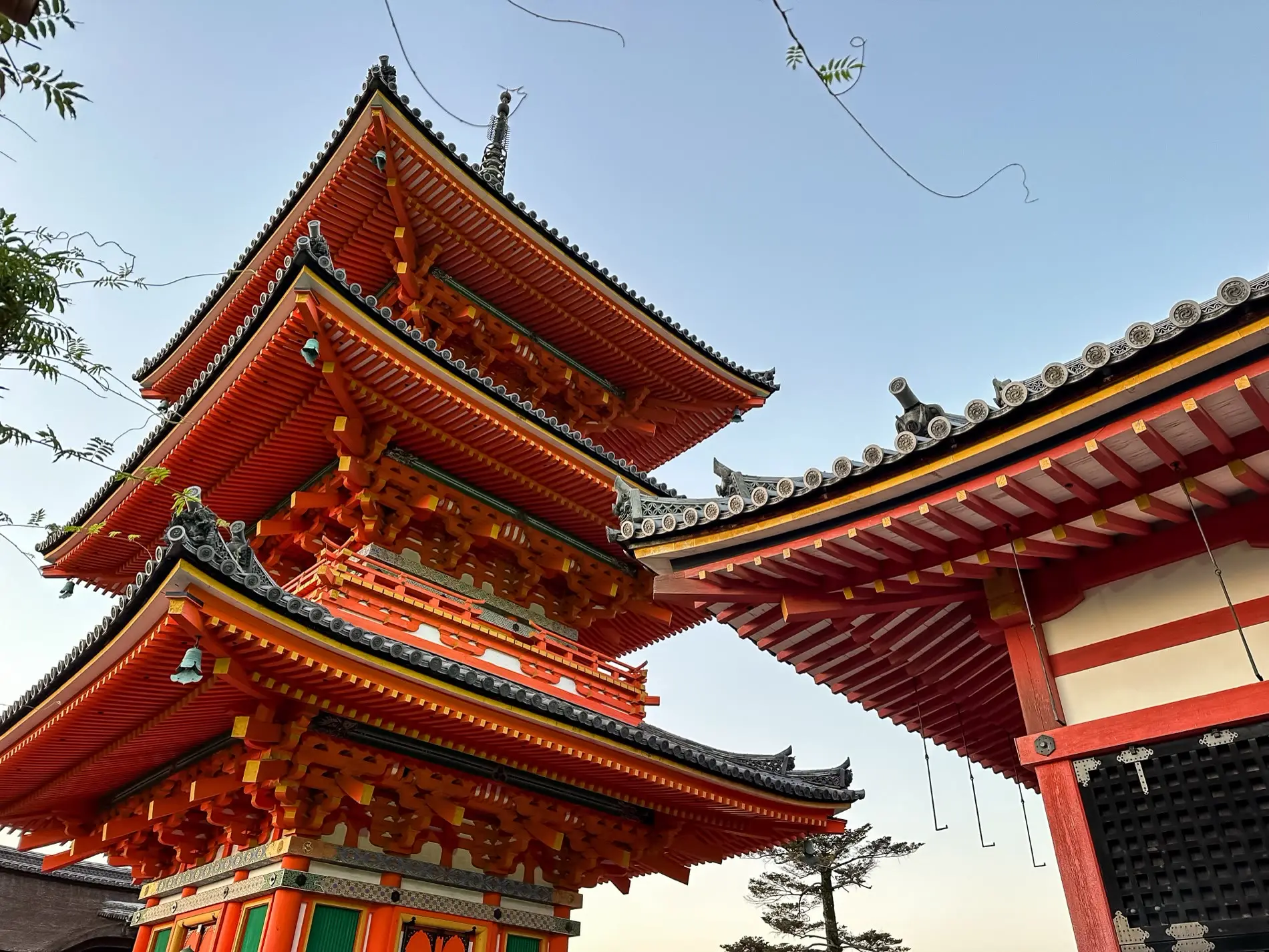 A historic pagoda overlooking Kyoto at sunset