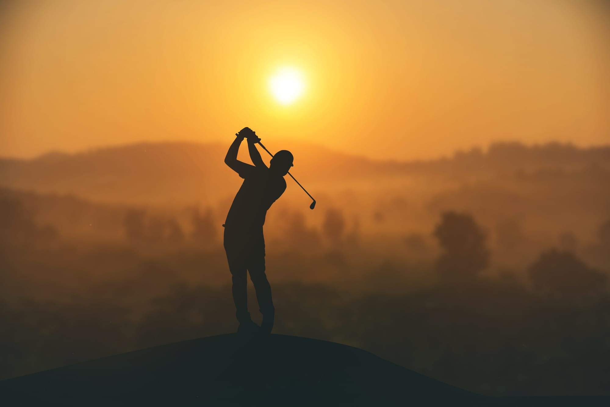 A golfer mid-swing against a sunset